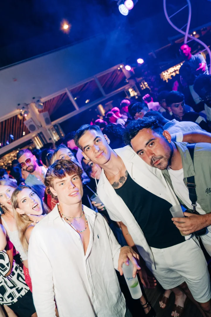 Lads and girls packed into Cafe Del Mar Malta dance floor, neon lights flashing and cold drinks fuelling the night crowd