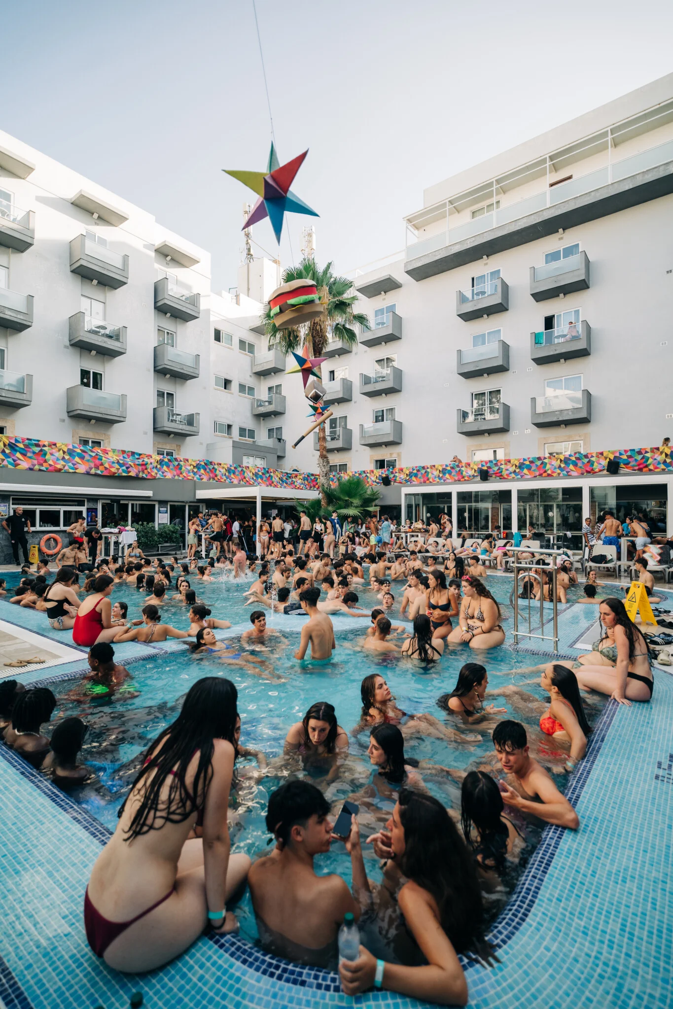 Wall-to-wall crowds filling Bora Bora Malta pool party, with splash dancing, cocktails in hand and nonstop afternoon party action