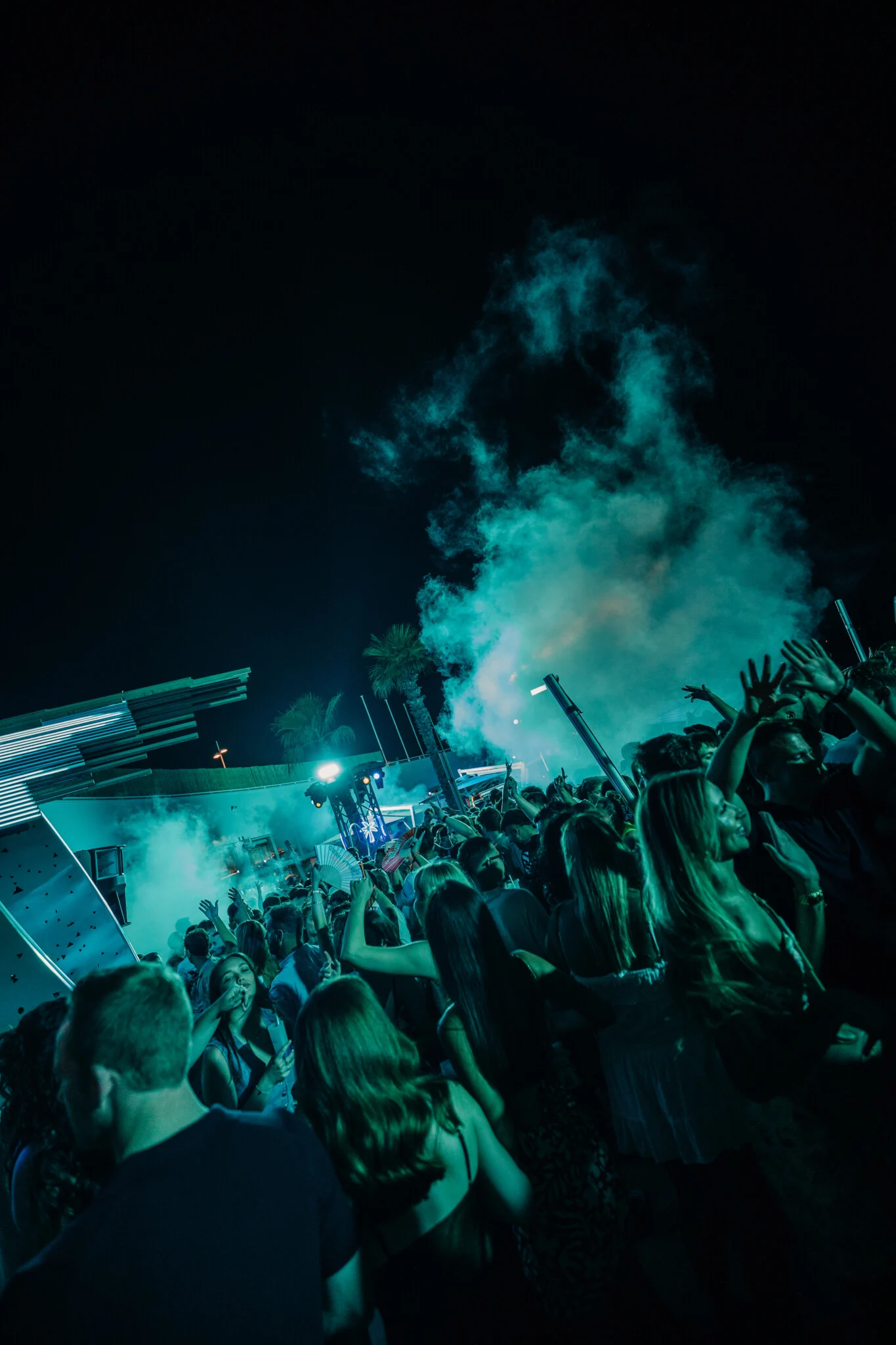 Smoke cannons blasting at Cafe Del Mar Malta as the crowd throws hands up and the terrace turns into a full late night rave zone