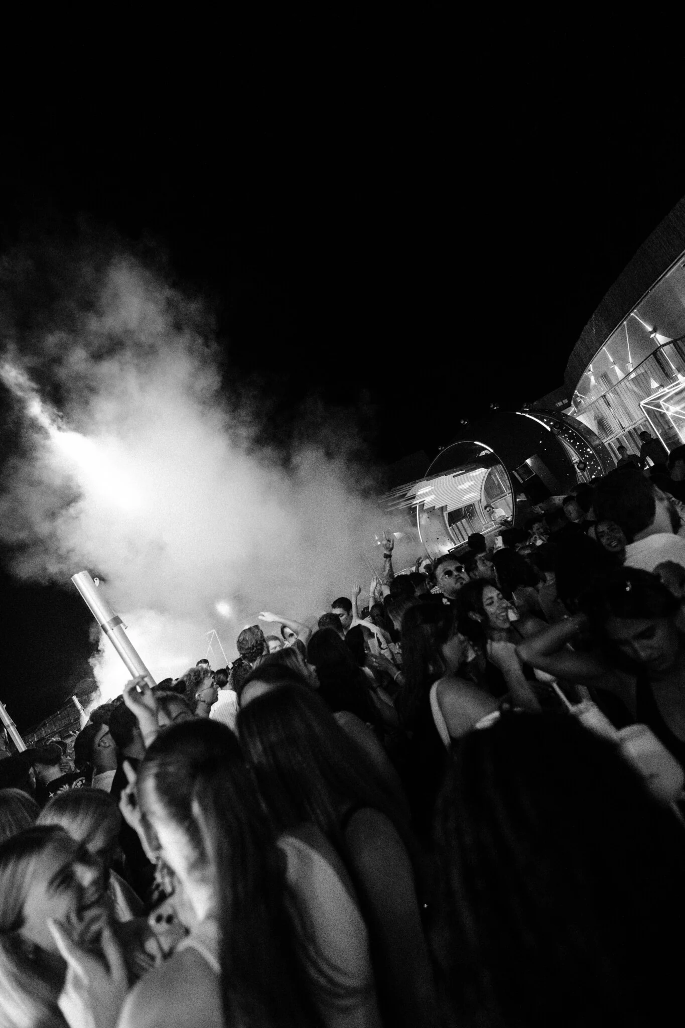 Black and white smoke cannons erupt over packed Cafe Del Mar Malta terrace as lads and girls lose it to late night drops