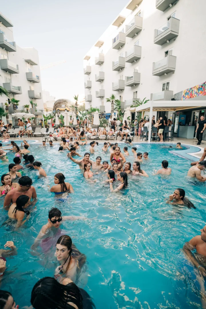 Huge daytime crowd splashing at Bora Bora Malta, pool bars busy, music loud and everyone in full holiday party mode