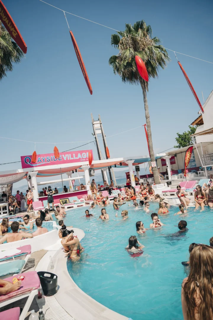 Packed pool at Baywatch Pool Party in Kavos with partygoers cooling off, drinks in hand and summer beats keeping the vibe alive