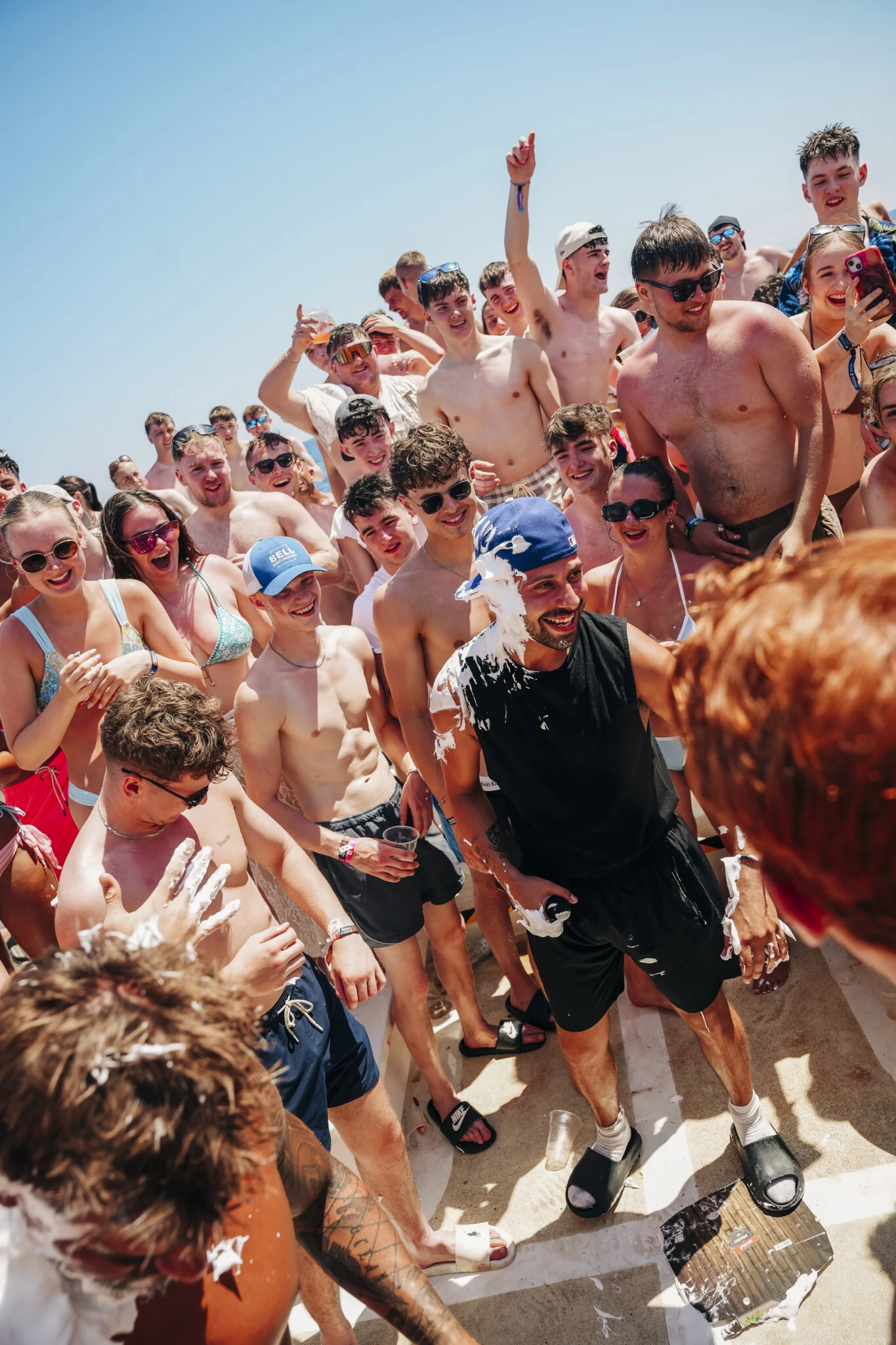 Lads and girls crack up on the Kavos Booze Cruise as a messy party game kicks off and the deck erupts in laughter