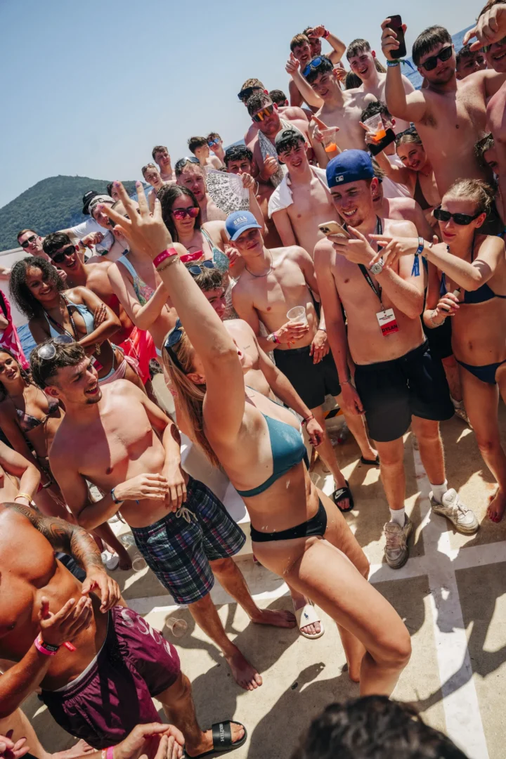 Girl takes centre stage as lads and girls crowd the deck on the Kavos Booze Cruise, cheering her on