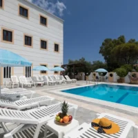 Lefkimi Hotel pool area with sunbeds, clear water and chilled daytime vibes, perfect base before Kavos nights kick off
