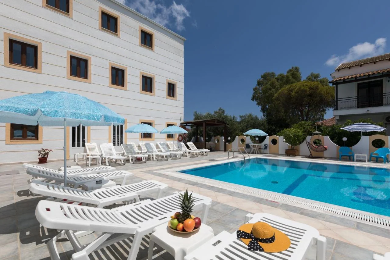 Lefkimi Hotel pool area with sunbeds, clear water and chilled daytime vibes, perfect base before Kavos nights kick off