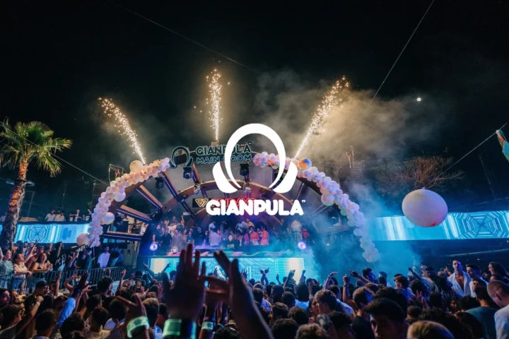 Packed crowd at Gianpula Main Room Club Night in Malta with fireworks, stage lights and the Gianpula logo above the dancefloor.