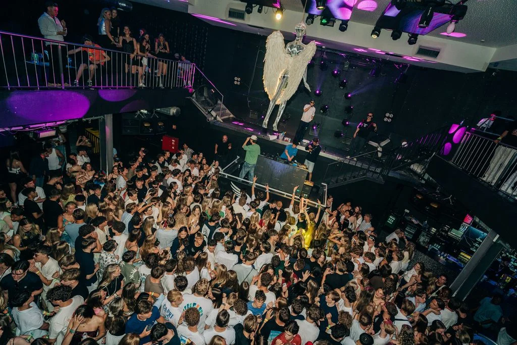 Packed dancefloor at Club Heaven, Albufeira as the crowd goes off under neon lights and huge party vibes.