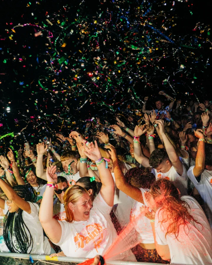 Kavos paint party crowd going wild as confetti rains down, hands up and chaos in full flow at one of the loudest nights