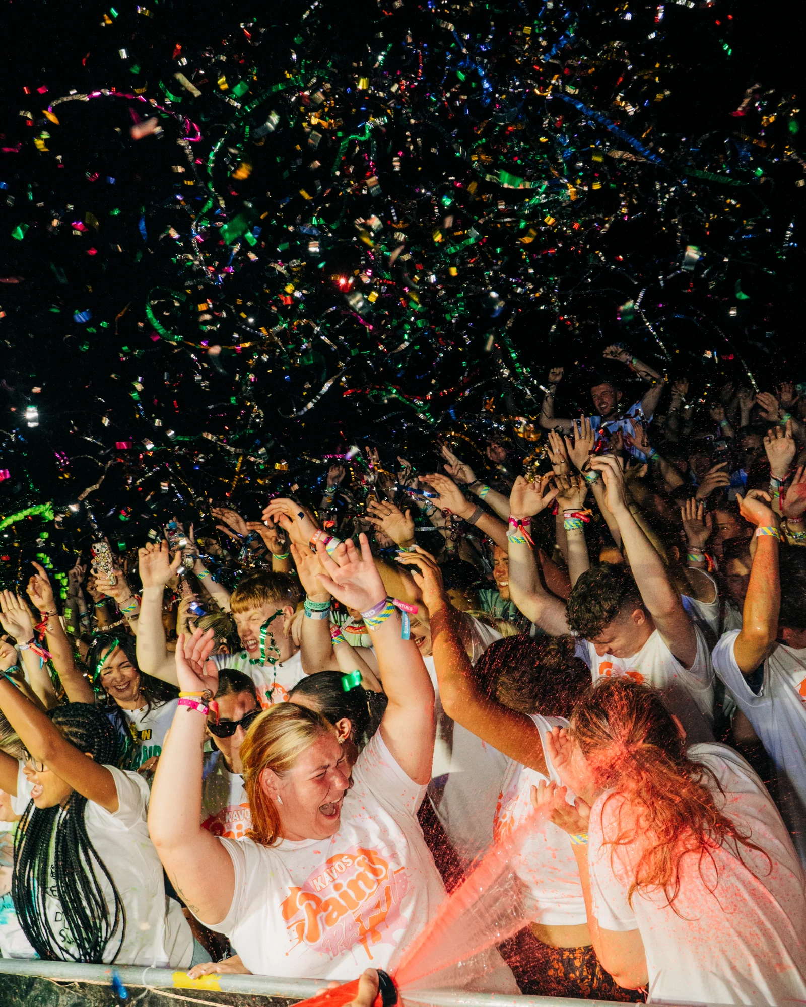 Kavos paint party crowd going wild as confetti rains down, hands up and chaos in full flow at one of the loudest nights