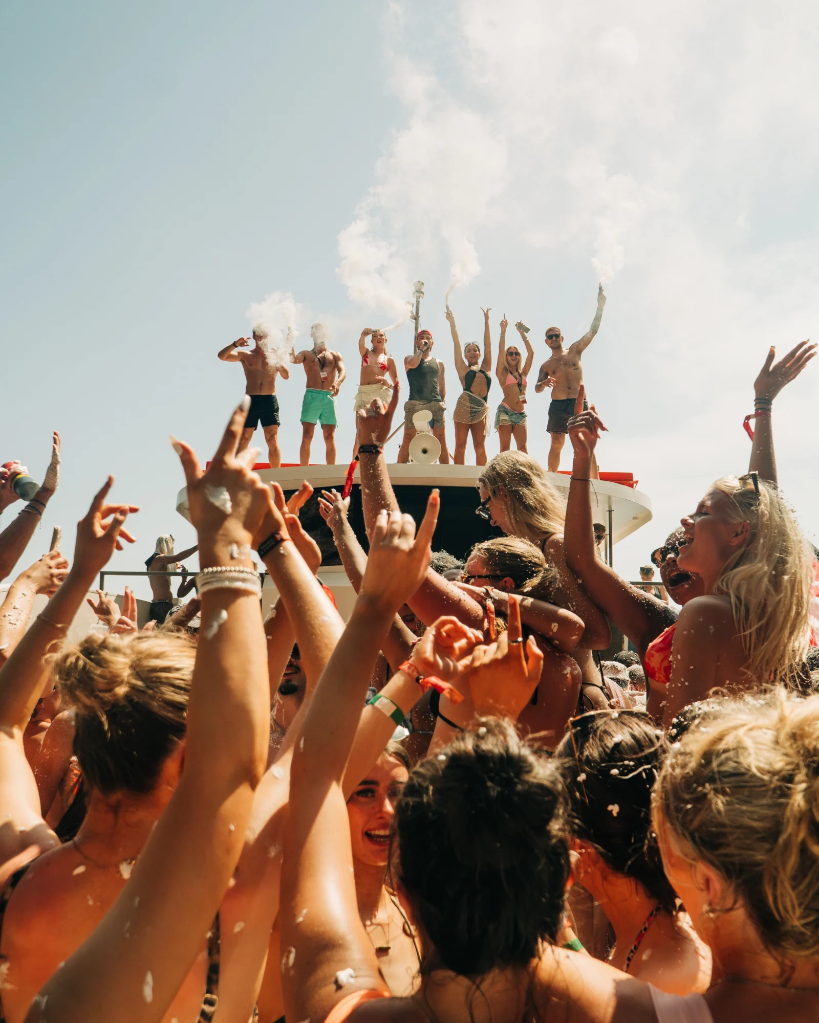 Kavos boat party erupts as dancers take over the top deck, smoke in the air and the crowd below goes off together