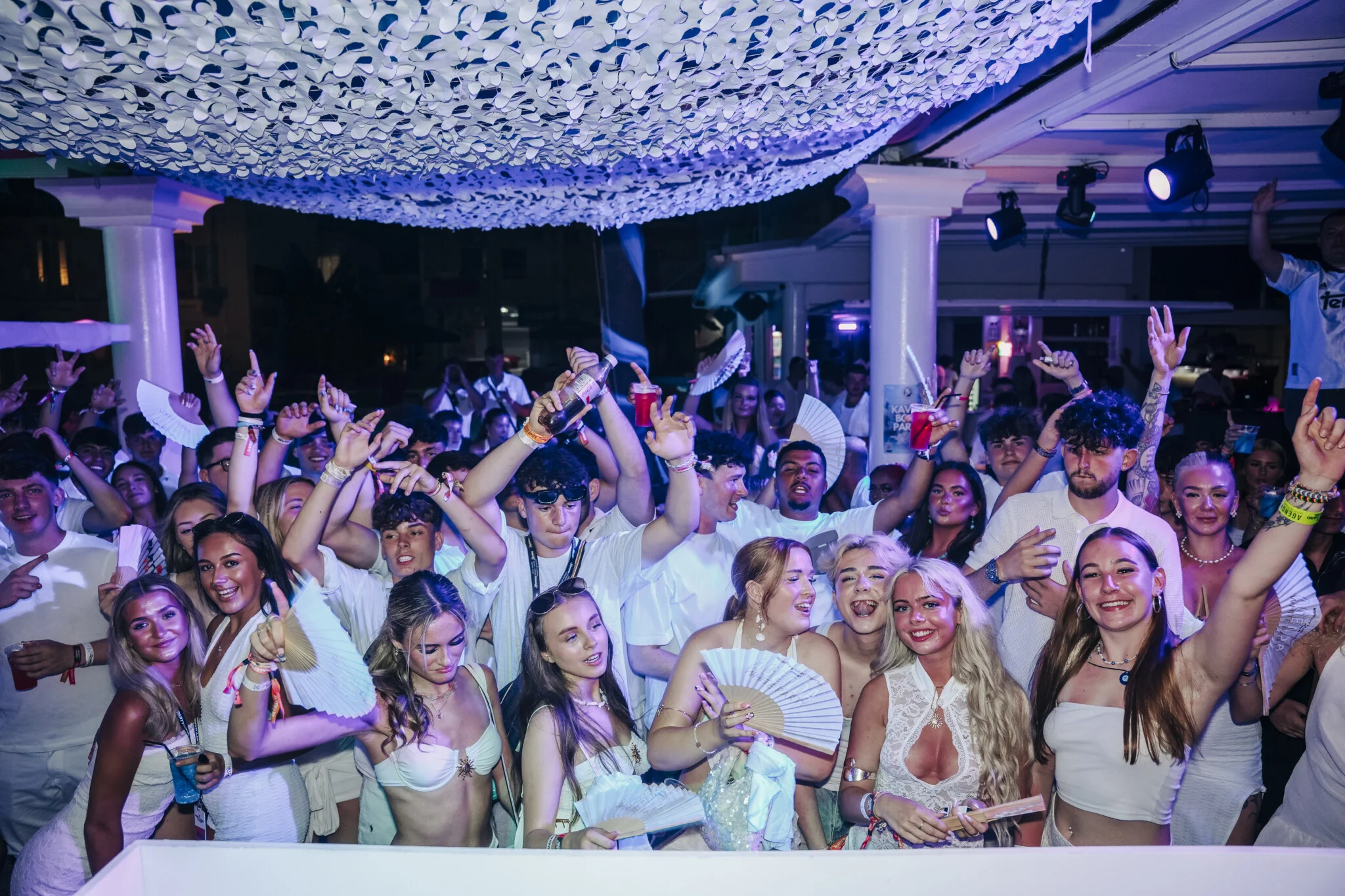 Trinity Club Kavos rammed with white party vibes, fans waving, drinks raised and the dancefloor jumping till late