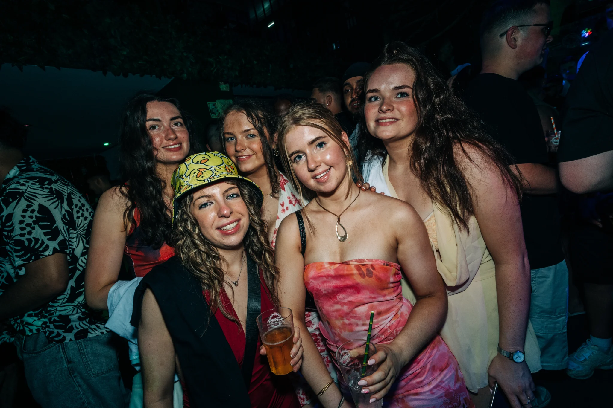Five girls posing with drinks at Love Juice Albufeira event in Tropicana Night Club during a busy night in the club