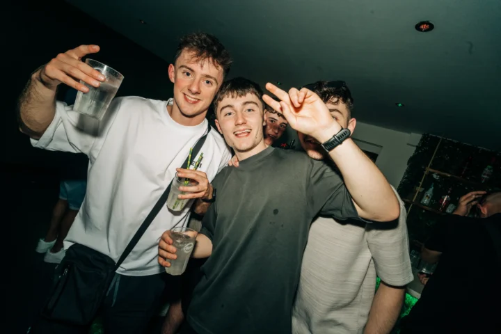 Group of lads posing with drinks at the Love Juice event in Tropicana Night Club Albufeira during a lively night out
