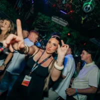 Girl dancing at the Love Juice Residency event in Tropicana Night Club Albufeira while the crowd parties around her under club lights