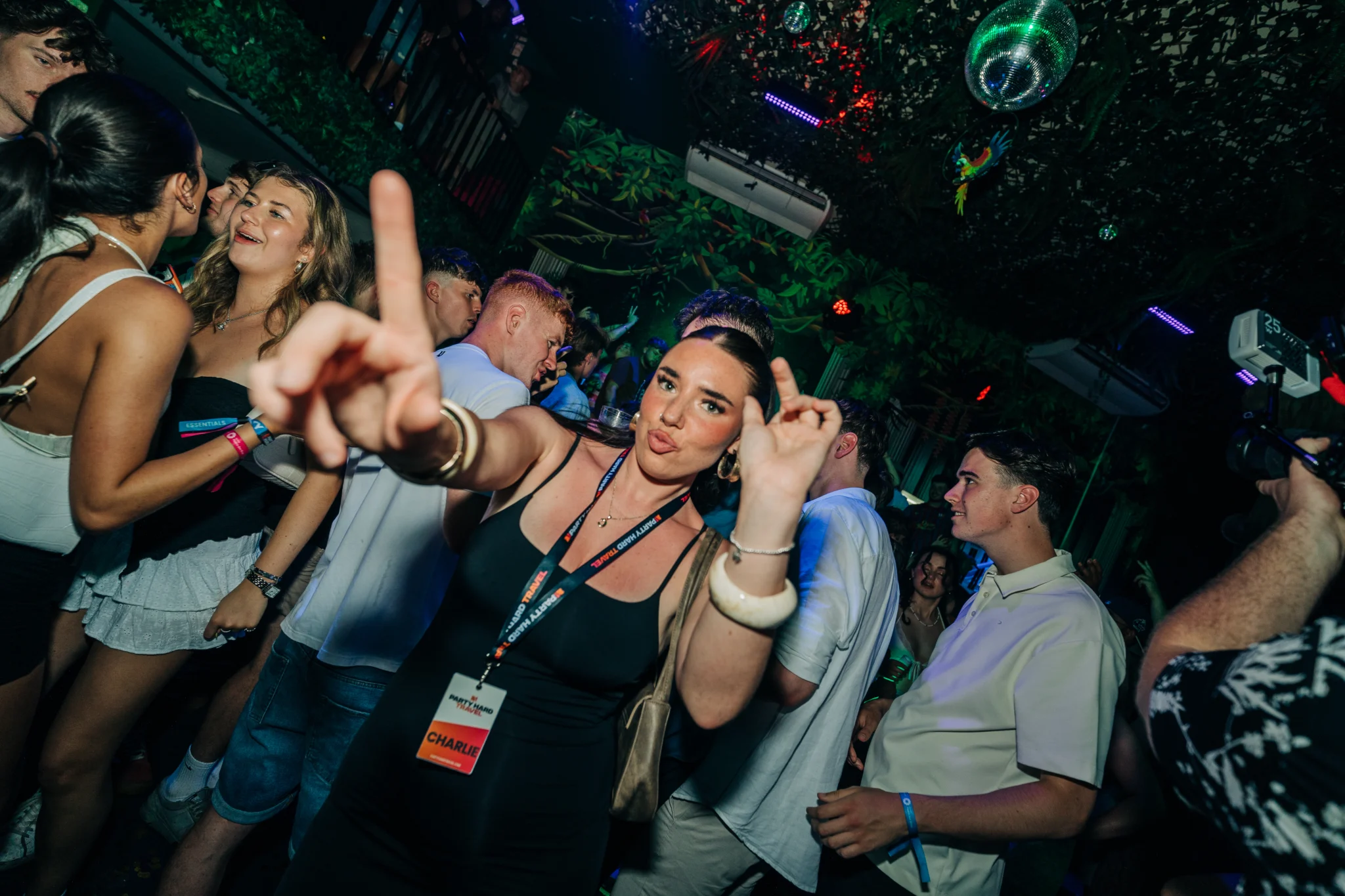 Girl dancing at the Love Juice Residency event in Tropicana Night Club Albufeira while the crowd parties around her under club lights